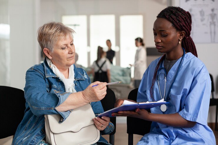african-american-nurse-explaining-sickness-treatment-elderly-patient_482257-10173