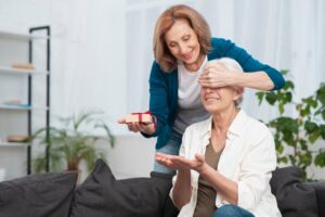 senior-woman-surprising-her-friend_23-2148354930